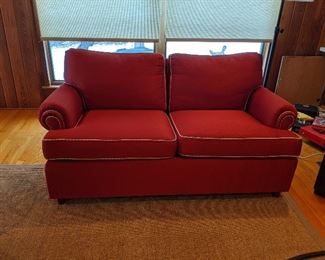 Brick red quilted Ethan Allen loveseat 64x35x33.  Small split needs repair $350