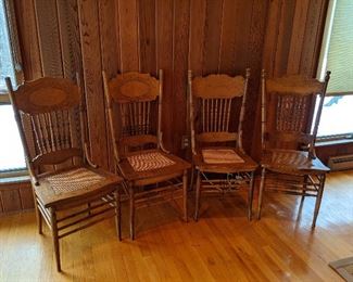 Four antique cane seat oak chairs very good condition.  $150