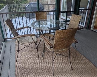 Rattan and wrought iron 36 inch table and four chairs.  $150