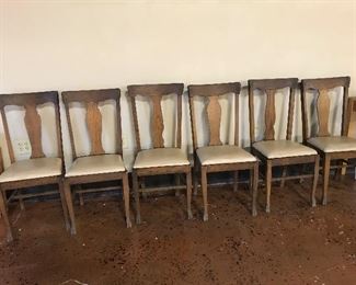 Six sturdy oak dining chairs