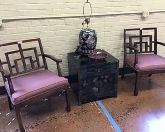 Handsome Chinese inspired chairs beside Chinese style table with storage.