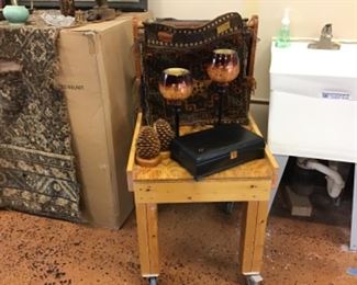 Pine cone bookends, camel saddle bags for your pet camel, tall candle globes, plus rolling table.  All for sale.