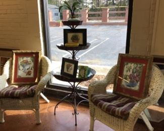 Wicker chairs with metal tiered garden stand.