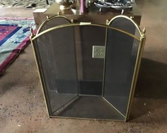 Heavy brass fire screen.