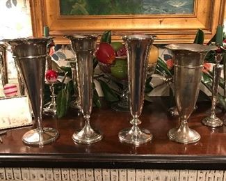 Beautiful sterling trumpet vases that are being professionally polished.