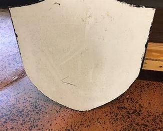 Large metal shield.  Just the very thing you need!