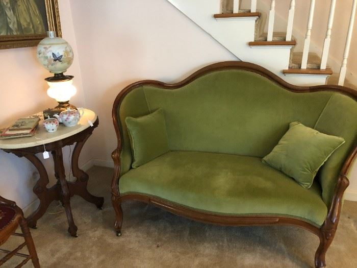 Antique settee, original finish. Upholstered in green.  $750. Available for sale EARLY.