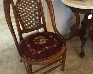 Carved antique chair with needlepoint seat. Available for sale EARLY. $150