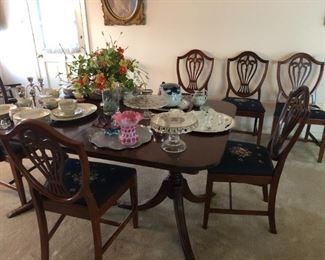 Drexel Duncan-Phyfe dining room set. Six chairs with custom needlepoint seats. Two leaves. Matching buffet and china cabinet available.