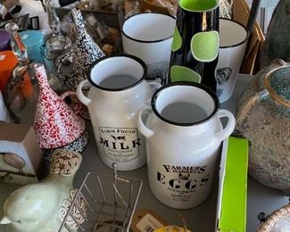 ceramic button coasters, metal speckleware funnels, enamel ware jugs, glass vase