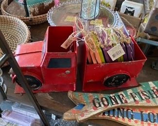 wood fishing signs, metal truck bookends, glass cake riser