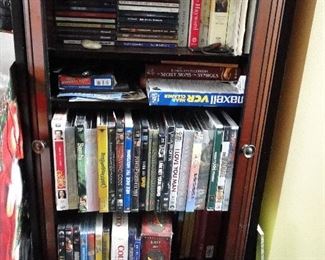 DVDs, CDs, and cabinet that holds them