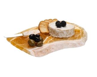 Hand carved Calcite cheese tray with matching knife. Also perfect for serving sushi as it has a small swell in it for the knife or holding wasabi and sauces. Several in stock $45
