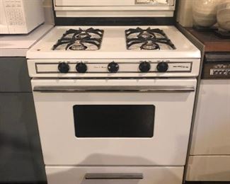 Gas Stove by Magic Chef with bottom warmer. Works fine but needs cleaning, 30" x 28" x 37" $100
