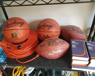 NCAA leather basketballs, signed Madden football. 