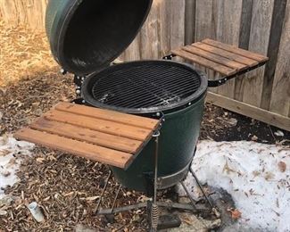 green egg with rolling wheet stand and two wooden counters