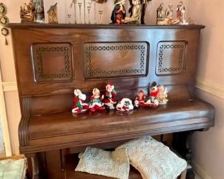 antique upright piano, lace tablecloth