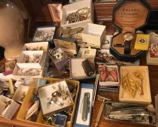 Tons of jewelry -pins, watches and more.