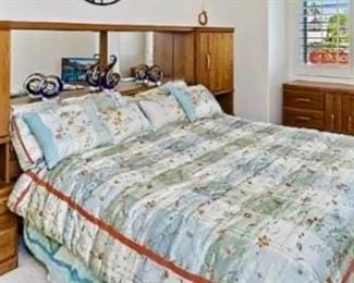 Queen bedroom set includes frame, box spring, mattress, backboard with drawers and cabinets, six drawer dresser and cabinet, and large attachable mirror
$140