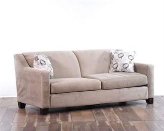 Two-Section Light Cream Sofa With Accent Pillows