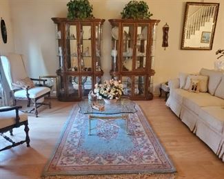 Beautiful Curios with Beveled Glass. Formal Living room furnishings and carpet and draperies