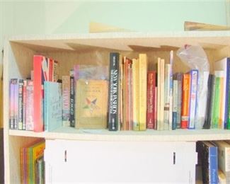 39. Top Shelf of open bookcase Cook Books, Sewing Books, DVDs