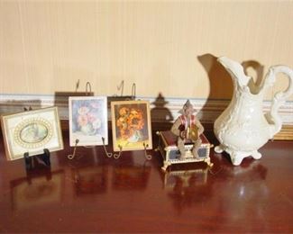 110. Five 5 items  Antique Pitcher  3 Framed Prints on Easels  Monkey Music Box