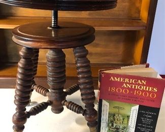 Clearance Lot #11: Antique claw foot swivel piano stool & antique Book. $100 for both. Shelf not included.