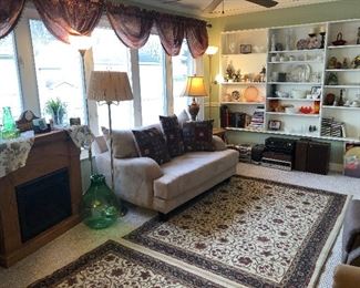 Area Rugs , Love Seat, Floor Lamp and Electric Fireplace!
