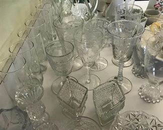 The water glasses on left are monogrammed with a “N”
