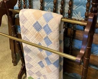Wood and brass quilt rack