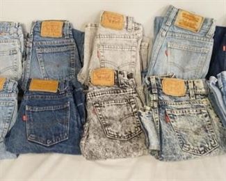 1015	LOT OF TEN PAIRS OF VINTAGE USA LEVI STRAUSS & COMPANY JEANS W/ RED TABS. ALL ARE YOUTH SIZES. TWO SIZES ARE UNKNOWN, THREE ARE SIZE 12, THE REST ARE SIZES; 9, 8, 10, 7 & 11. VARYING DEGREES OF WEAR 
