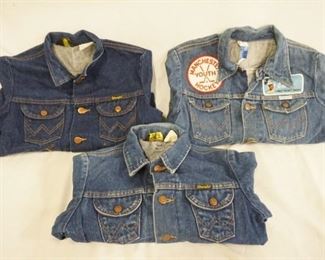 1042	LOT OF THREE VINTAGE WRANGLER DENIM JACKETS ALL ARE MARKED MADE IN USA. ONE JACKET IS DECORATED W/ VARIOUS PATCHES SIZE IS FADED IT MEASURES APP. 15 1/2 IN SHOULDER TO SHOULD, THE OTHER TWO ARE SIZES 14 & 16. VARYING DEGREES OF WEAR 
