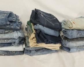 1045	LOT OF 37 PAIRS OF VINTAGE LEVI'S JEANS ALL ARE SHORTS/HAVE BEEN CUT INTO SHORTS. VARYING DEGREES OF WEAR 
