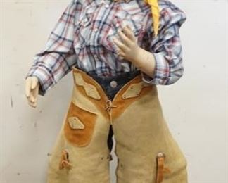 1047	YOUNG BOY MANNEQUIN CLOTHED IN VINTAGE LEVI'S JEANS, CHAPS, BANDANNA, DABBY ON DABBY SHIRT & A SHEPLERS COWBOY HAT. MANNEQUIN IS MISSING A FINGER ON THE RIGHT HAND. APP. 38 IN TALL 
