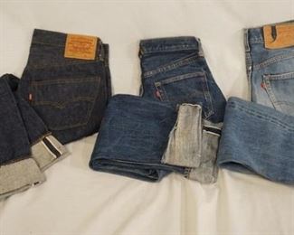1052	LOT OF THREE PAIRS OF LEVIS SELVEDGE JEANS ONE IS SIZE 32 X 32 REVERSE OF TOP BUTTON IS STAMPED 6, ONE PAIR THE SIZE LABEL IS MISSING WAIST MEASURES APP. 27 IN REVERSE OF TOP BUTTON IS STAMPED 6 & ONE IS SIZE 30 X 32 THE REVERSE OF THE TOP BUTTON IS STAMPED 5 
