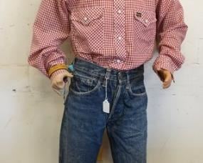 1069	BOY MANNEQUIN CLOTHED IN VINTAGE SELVEDGE LEVIS JEANS W/ BIG E, PRO KEDS SNEAKERS, VINTAGE WRANGLER SHIRT & A GW COWBOY HAT. IS MISSING A FINGER ON LEFT HAND. APP. 60 IN TALL. MANNEQUIN MAY SUFFER LOSSES TO BODY/FACE 
