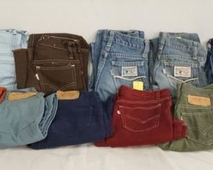 1076	LOT OF 13 PAIRS OF VINTAGE LEVIS PANTS W/ WHITE TABS. ALL ARE YOUTH SIZES. VARYING DEGREES OF WEAR 

