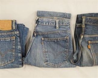 1092	LOT OF THREE PAIRS OF LEVIS JEANS W/ BIG E & ORANGE TABS. TWO PAIRS ARE FLARE & WAISTS MEASURE APP. 30 IN & 32 IN. THE THIRD PAIR IS STRAIGHT LEG & WAIST MEASURES APP. 28 IN 
