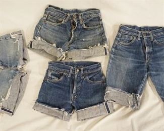 1099	LOT OF FOUR PAIRS OF VINTAGE LEVIS SELVEDGE JEANS THAT HAVE BEEN CUT INTO SHORTS. APP. WAIST MEASUREMENTS ARE 27 IN, 26 IN, & TWO ARE 24 IN. VARYING DEGREES OF WEAR 

