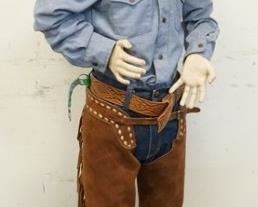 1103	BOY MANNEQUIN CLOTHED IN LEE JEANS, BELT, CHAPS, LEE SHIRT, HAT TIE CLIP, COWBOY BOOTS & COWBOY HAT. APP. 57 IN TALL. MANNEQUIN MAY SUFFER LOSSES TO BODY/FACE 
