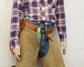 1105	BOY MANNEQUIN CLOTHED IN VINTAGE LEVIS SELVEDGE JEANS W/ BIG E, CHAPS, BANDANNA, VINTAGE WRANGLER WESTERN SHIRT, & A COWBOY HAT. APP. 60 IN TALL. MANNEQUIN MAY SUFFER LOSSES TO BODY/FACE
