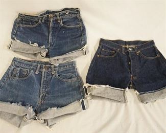1120	LOT OF THREE PAIRS OF VINTAGE LEVIS SELVEDGE JEANS THAT HAVE BEEN CUT INTO SHORT. WAIST MEASUREMENTS ARE APP. 28-29 IN. VARYING DEGREES OF WEAR 
