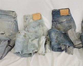 1137	LOT OF FOUR PAIRS OF VINTAGE LEVIS SELVEDGE JEANS. EACH PAIR HAS CONSIDERABLE WEAR & DAMAGE (SEE PHOTOS) APP. WAIST MEASUREMENTS ARE; 26 IN (NO NUMBER/LETTER IS VISIBLE ON REVERSE OF TOP BUTTON) 27 IN- REVERSE OF TOP BUTTON IS STAMPED 8.  26 IN REVERSE OF TOP BUTTON IS STAMPED K. AND 29 IN REVERSE OF TOP BUTTON IS STAMPED 16. 
