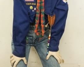 1144	BOY MANNEQUIN CLOTHED IN LEVIS JEANS, SNEAKERS, BASEBALL CAP, SHIRT W/ BOY SCOUTS RELATED PINS & PATCHES, SCARF W/ A BOY SCOUTS CLIP, & A BELT W/ BOY SCOUTS BELT BUCKLE.APP. 44 IN TALL MANNEQUIN MAY SUFFER LOSSES TO BODY/FACE

