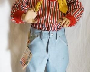 1188	BOY MANNEQUIN CLOTHED IN VINTAGE WRANGLER JEANS W/ COLORING BOOKLET ATTACHED COPY RIGHT DATED 1962, COWBOY BOOTS, ROY ROGERS WESTERN SHIRT, ROY ROGERS BANDANNA, & A ROY ROGERS COWBOY HAT. IS MISSING FINGERS ON BOTH HANDS. APP. 48 IN TALL. MANNEQUIN MAY SUFFER LOSSES TO BODY/FACE
