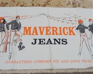 1193	VINTAGE MAVERICK JEANS ADVERTISING BANNER WHICH READS * MAVERICK JEANS GUARANTEED COMFORT FIT & LONG WEAR* IT IS 69 1/4 IN X 37 IN 
