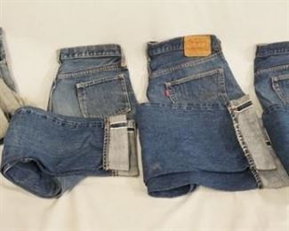 1198	LOT OF FOUR PAIRS OF VINTAGE LEVIS SELVEDGE JEANS W/ BIG E (ONE PAIR HAS BLACK TAB, THE REST HAVE RED TABS) TWO THE SIZES ARE UNKOWN WAIST MEASURES APP. 28 IN-NO NUMBER IS VISIBLE ON REVERSE OF TOP BUTTON, & APP. 30 IN THE REVERSE OF TOP BUTTON IS STAMPED 6. THE OTHER TWO SIZES ARE MARKED; 38 X 31-REVERSE OF TOP BUTTON IS STAMPED 6 & 38 X 32-REVERSE OF TOP BUTTON IS STAMPED 16. VARYING DEGREES OF WEAR 
