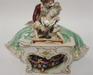 1050	GERMAN FIGURE OF MAN & WOMAN PLAYING PIANO, 7 IN HIGH X 9 IN WIDE
