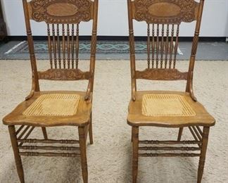 1054	PAIR OF OAK PRESSED BACK CHAIRS
